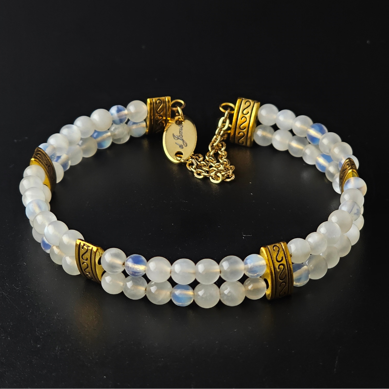 Moonstone 4mm Double Strand Bracelet featuring luminous beads with subtle flashes of iridescence on silver-plated memory wire with a fixed safety chain.
