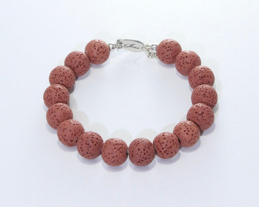 Handmade Red Lava Rock Bracelet showcasing 10mm vibrant red lava beads on plated stainless steel memory wire with a fixed safety chain.