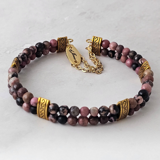 Rhodonite 4mm Double Strand Bracelet featuring soft pink beads with natural black veining on silver-plated memory wire with a fixed safety chain.