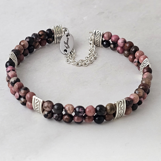 Rhodonite 4mm Double Strand Bracelet featuring soft pink beads with natural black veining on silver-plated memory wire with a fixed safety chain.