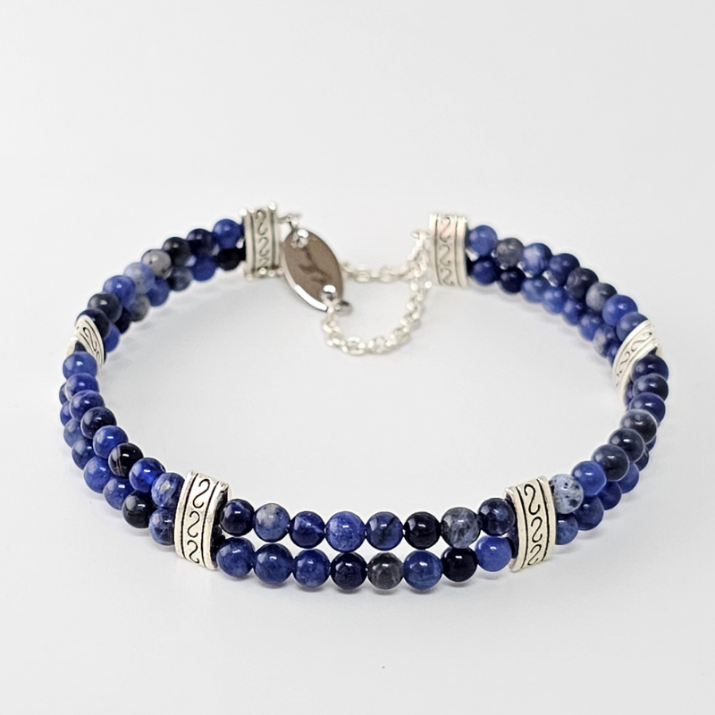 Sodalite 4mm Double Strand Bracelet featuring calming blue beads on silver-plated memory wire with a fixed safety chain.