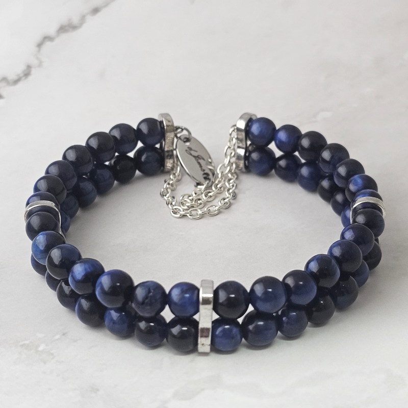 Stylish Blue Tiger’s Eye 6mm double strand bracelet featuring deep blue polished beads, silver accent spacers, and a silver clasp with adjustable chain and engraved charm.