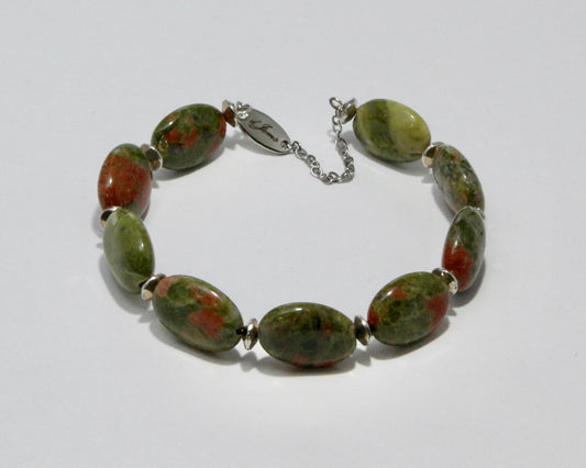 Handmade Unakite Bracelet showcasing 18x13mm green and pink mottled beads with elegant spacers on plated stainless steel memory wire with a fixed safety chain.