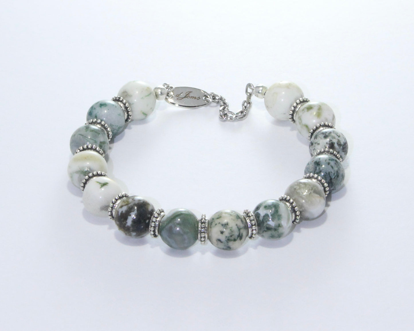 Handmade Glossy Tree Agate Bracelet showcasing 10mm glossy tree agate beads with dendritic patterns and elegant spacers on plated stainless steel memory wire with a fixed safety chain.