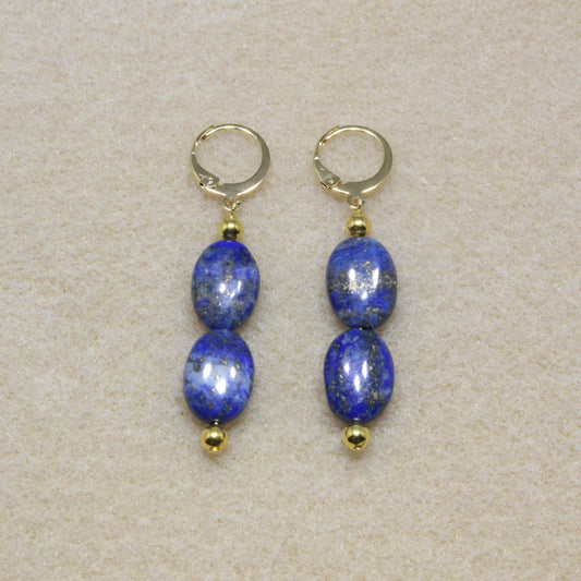 Pair of Lapis Lazuli Drop Earrings showcasing natural deep blue stones with lever-back closures, highlighting the stone's rich color and smooth texture.