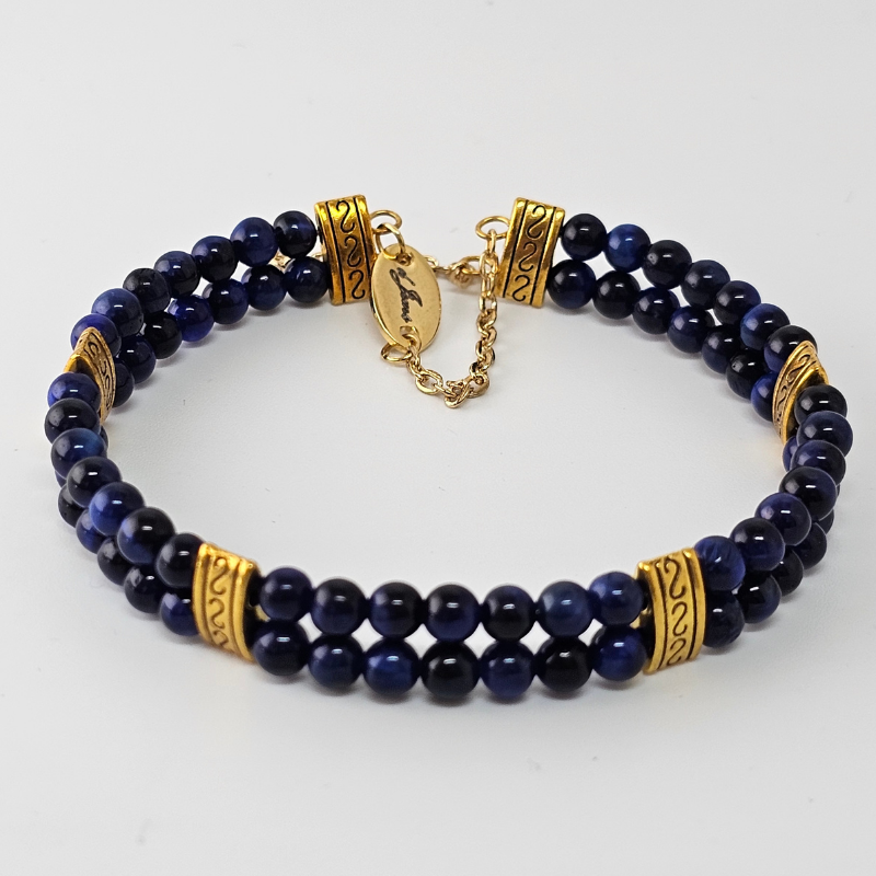 Blue Tiger's Eye 4mm Double Strand Bracelet featuring deep blue beads with natural chatoyancy on silver-plated memory wire, secured with a fixed safety chain.