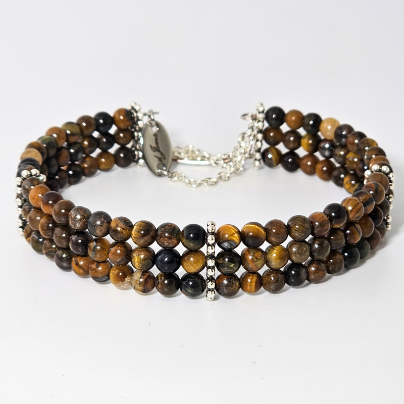 Brown Tiger's Eye 4mm Triple Strand Bracelet featuring golden-brown chatoyant beads on silver-plated memory wire with a fixed safety chain