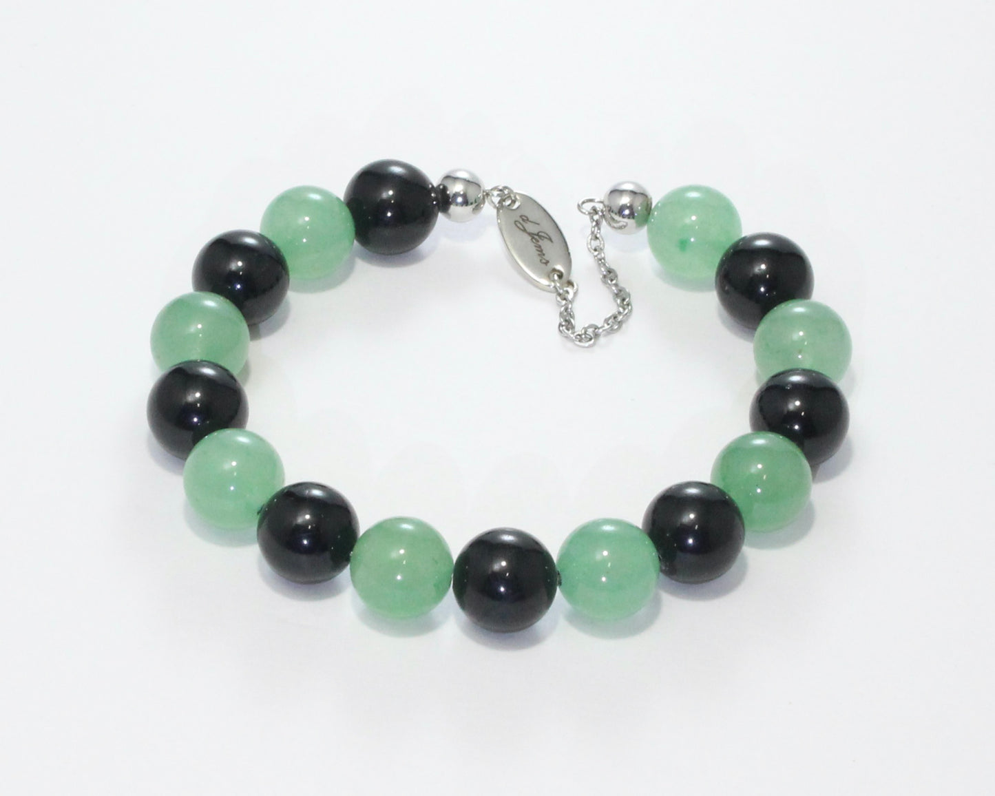 Handmade Tourmaline & Aventurine Bracelet showcasing 10mm black tourmaline and green aventurine beads on plated stainless steel memory wire with a fixed safety chain.