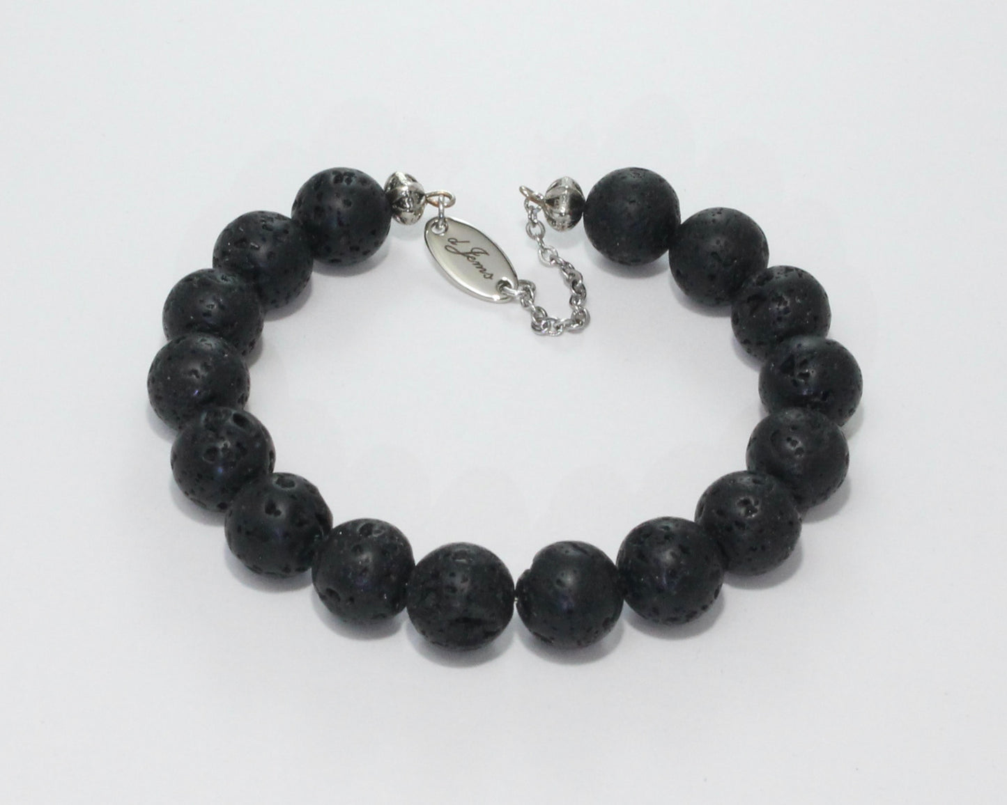 Handmade Black Lava Rock Bracelet showcasing 10mm natural lava rock beads on plated stainless steel memory wire with a fixed safety chain.