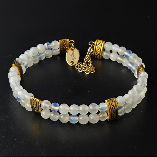 Moonstone 4mm Double Strand Bracelet featuring luminous beads with subtle flashes of iridescence on silver-plated memory wire with a fixed safety chain.