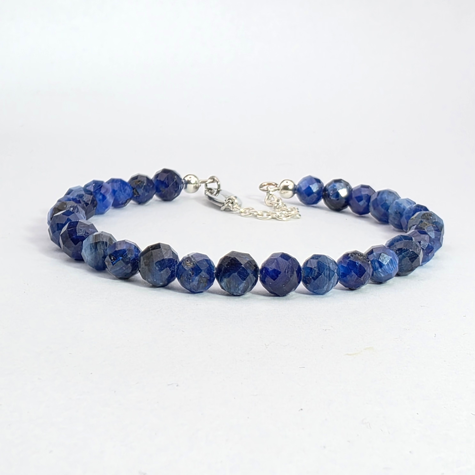 Blue beaded bracelet on a white background