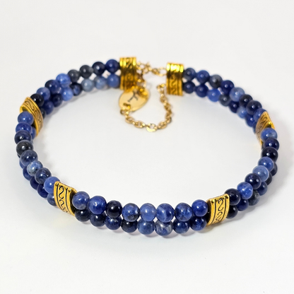 Sodalite 4mm Double Strand Bracelet featuring calming blue beads on silver-plated memory wire with a fixed safety chain.