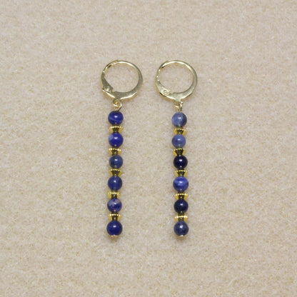 Handmade Sodalite Dangle Earrings featuring 4mm royal blue sodalite beads with creamy white veins on gold-tone lever-back hooks.