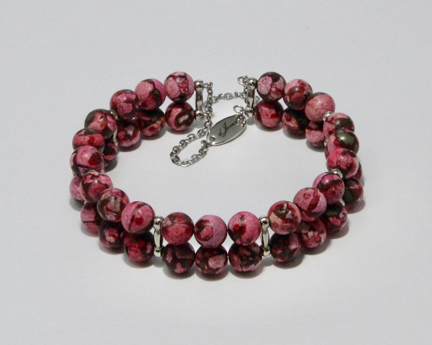 Handmade Dark Pink Howlite Double Bracelet showcasing 8mm soft pink beads on plated stainless steel memory wire with a fixed safety chain.

