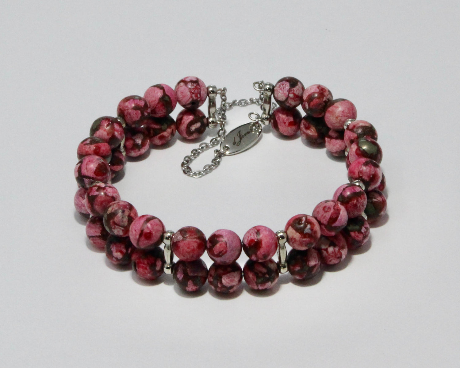Handmade Dark Pink Howlite Double Bracelet showcasing 8mm soft pink beads on plated stainless steel memory wire with a fixed safety chain.

