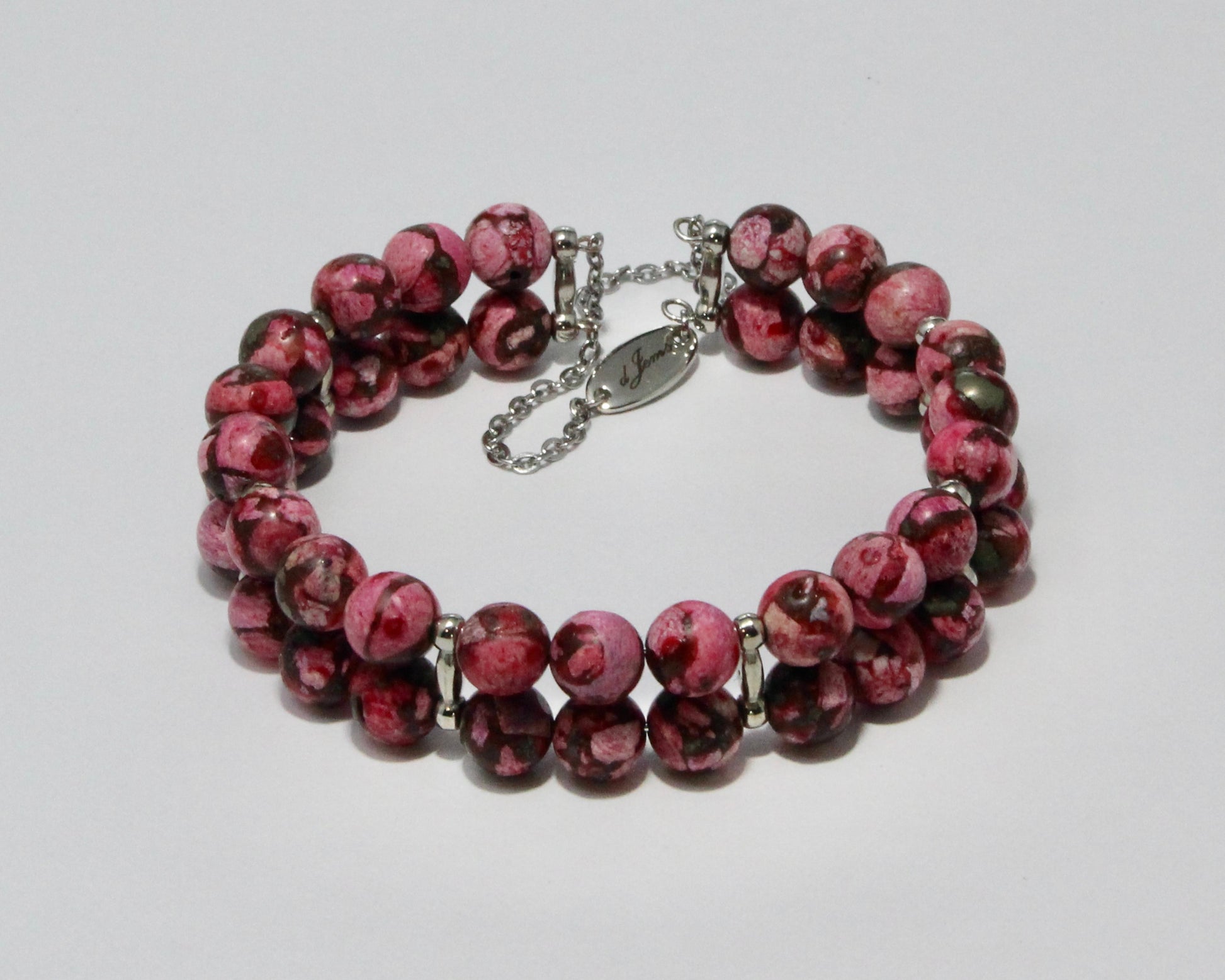 Handmade Dark Pink Howlite Double Bracelet showcasing 8mm soft pink beads on plated stainless steel memory wire with a fixed safety chain.

