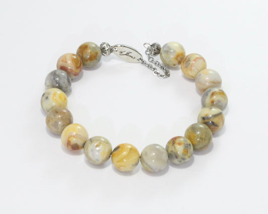 Handmade Crazy Lace Agate Bracelet showcasing 10mm multicolored beads with swirling patterns on plated stainless steel memory wire with a fixed safety chain.

