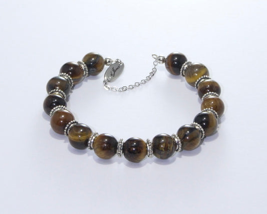 Handmade Brown Tiger's Eye Bracelet showcasing 10mm golden-brown chatoyant beads with elegant spacers on plated stainless steel memory wire with a fixed safety chain.