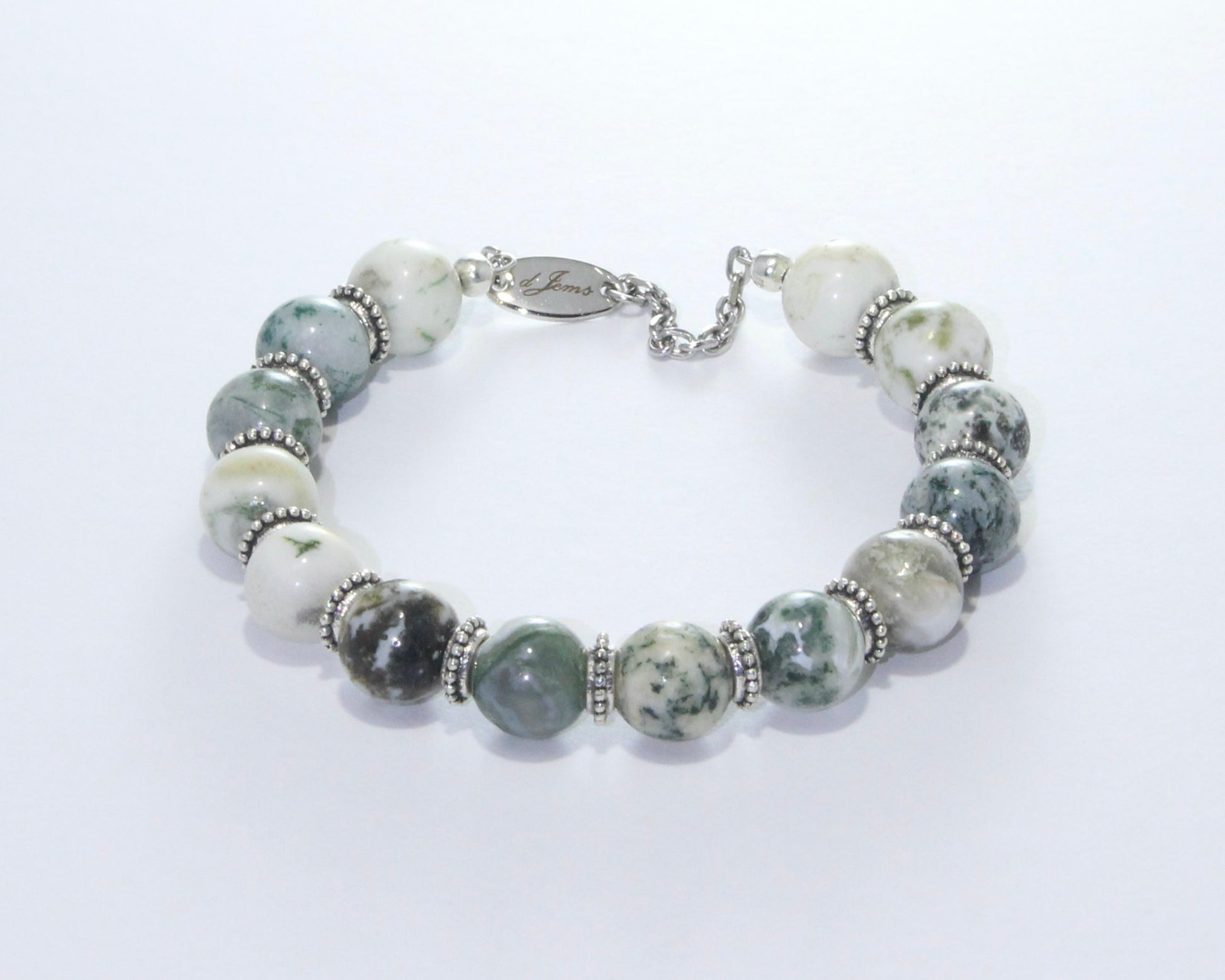 Handmade Glossy Tree Agate Bracelet showcasing 10mm glossy tree agate beads with dendritic patterns and elegant spacers on plated stainless steel memory wire with a fixed safety chain.