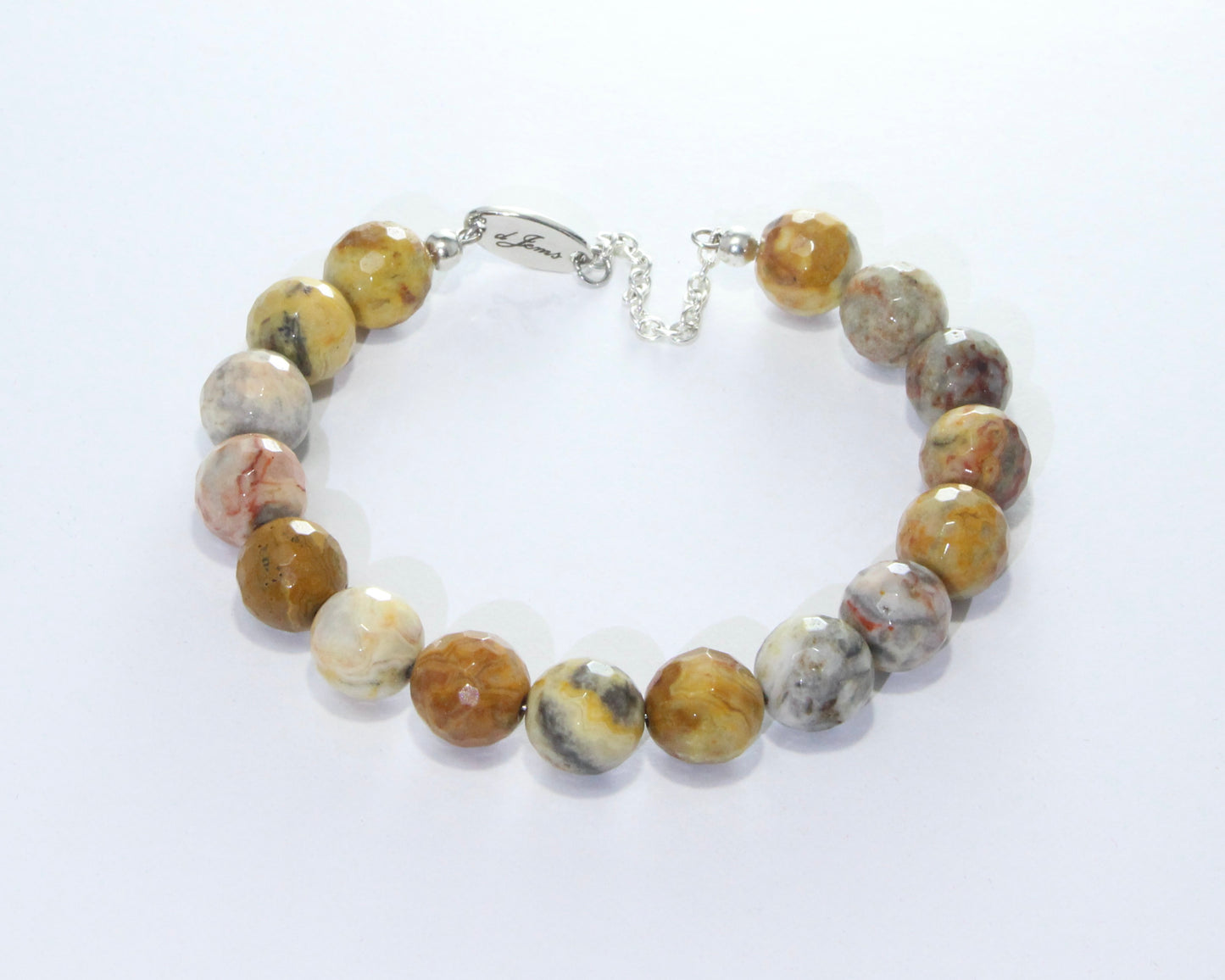 Handmade Faceted Crazy Lace Agate Bracelet showcasing 10mm faceted beads in reds, browns, and creams on plated stainless steel memory wire with a fixed safety chain.