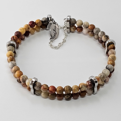 Crazy Lace Agate 4mm Double Strand Bracelet showcasing earthy-toned beads with natural swirling patterns on silver-plated memory wire, secured with a fixed safety chain.