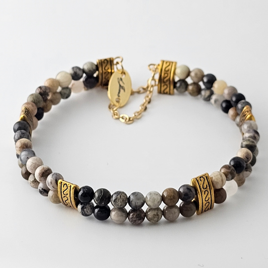 Crazy Lace Agate Silver Double Strand Bracelet showcasing 4mm beads with swirling patterns in grey, cream, and silver tones on silver-plated memory wire, secured with a fixed safety chain.