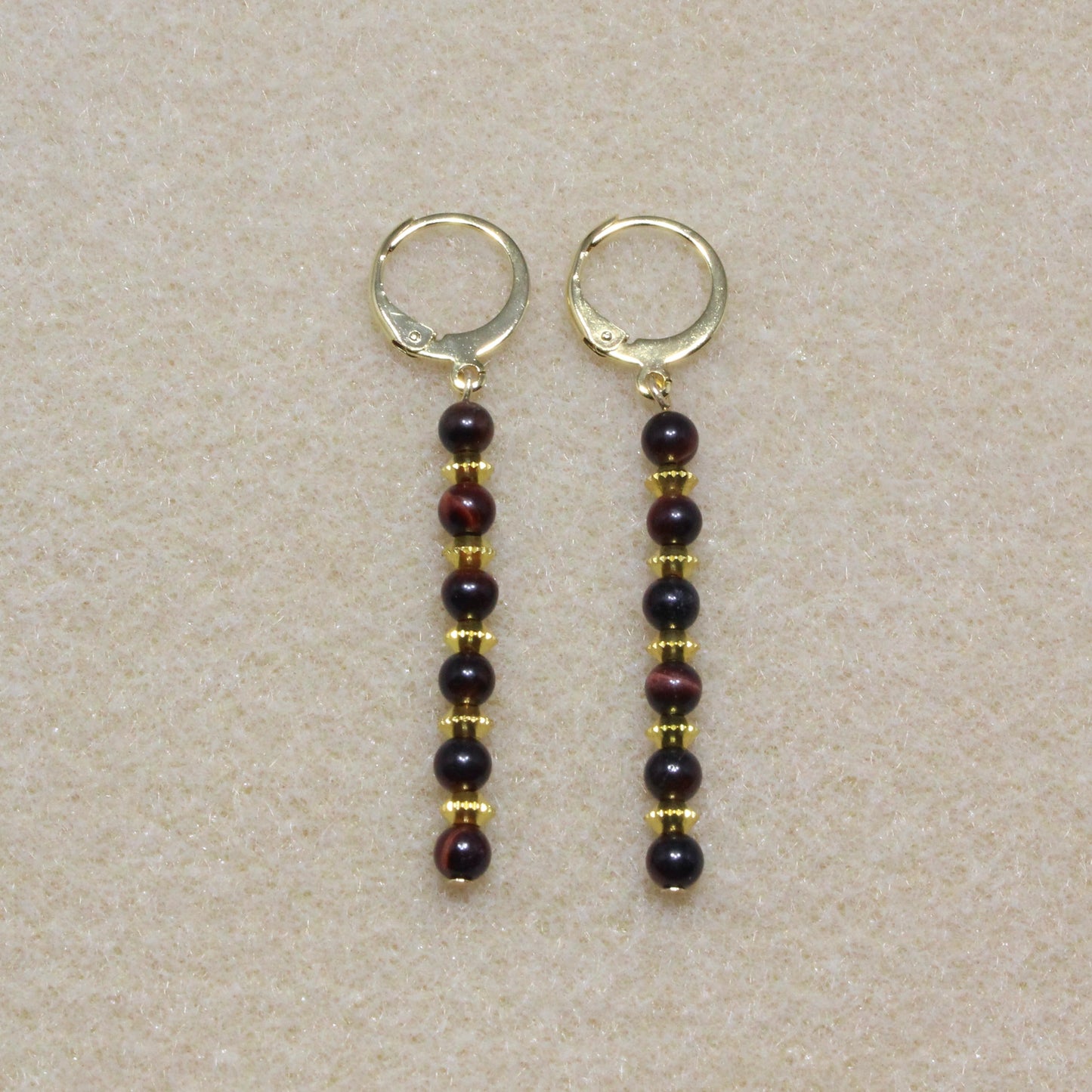 Pair of Red Tiger's Eye Dangle Earrings showcasing 4mm natural red tiger's eye beads with lever-back closures, highlighting the stone's rich reddish-brown hue.