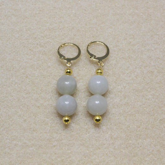 Pair of Jade Drop Earrings showcasing 10mm natural jade beads with lever-back closures, highlighting the stone's rich green hue and smooth texture.