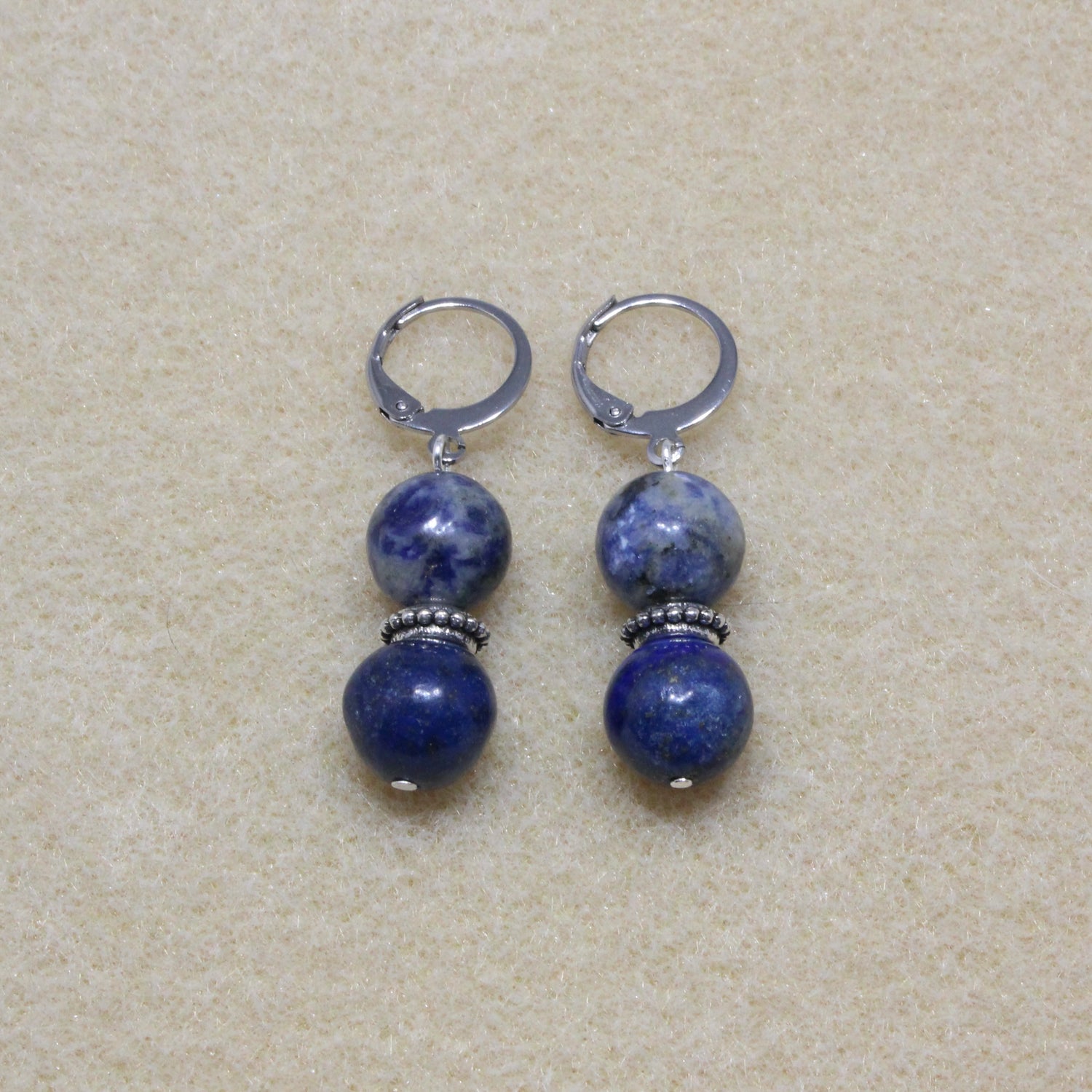 Pair of Azurite Drop Earrings showcasing 10mm deep blue stones with lever-back closures, highlighting the stone's unique patterns.