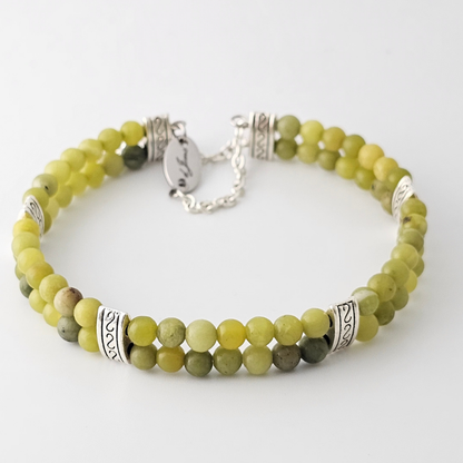 Taiwan Jade 4mm Double Strand Bracelet featuring smooth green beads on silver-plated memory wire with a fixed safety chain.