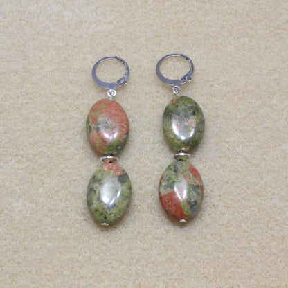 Close-up image of Unakite Drop Earrings showcasing the natural green and pink mottled patterns of the stones, set with lever-back closures.

