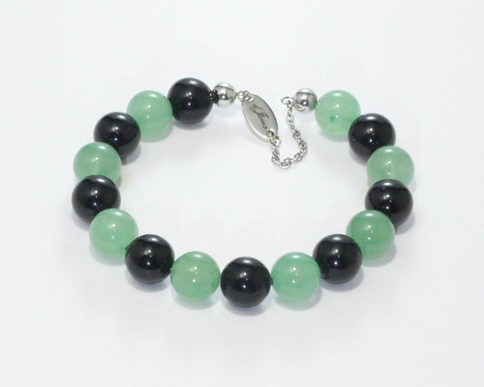 Handmade Tourmaline & Aventurine Bracelet showcasing 10mm black tourmaline and green aventurine beads on plated stainless steel memory wire with a fixed safety chain.