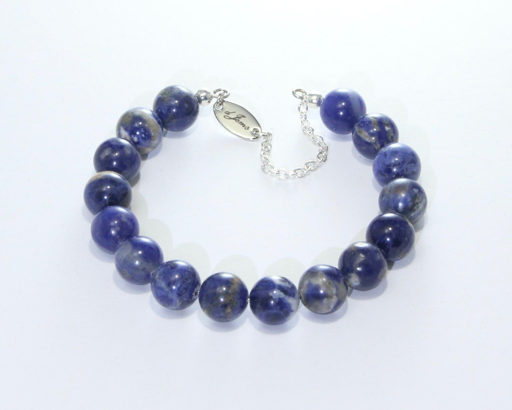 Handmade Sodalite Bracelet featuring 10mm royal blue sodalite beads with creamy white veins on plated stainless steel memory wire with a fixed safety chain.