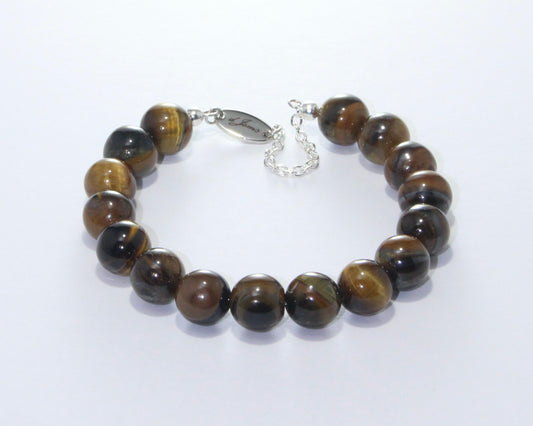 Handmade Brown Tiger's Eye Bracelet showcasing 8mm or 10mm golden-brown beads with chatoyant patterns on plated stainless steel memory wire with a fixed safety chain.