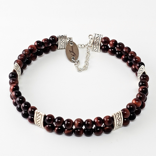 Red Tiger's Eye 4mm Double Strand Bracelet featuring deep reddish-brown beads on silver-plated memory wire, secured with a fixed safety chain.